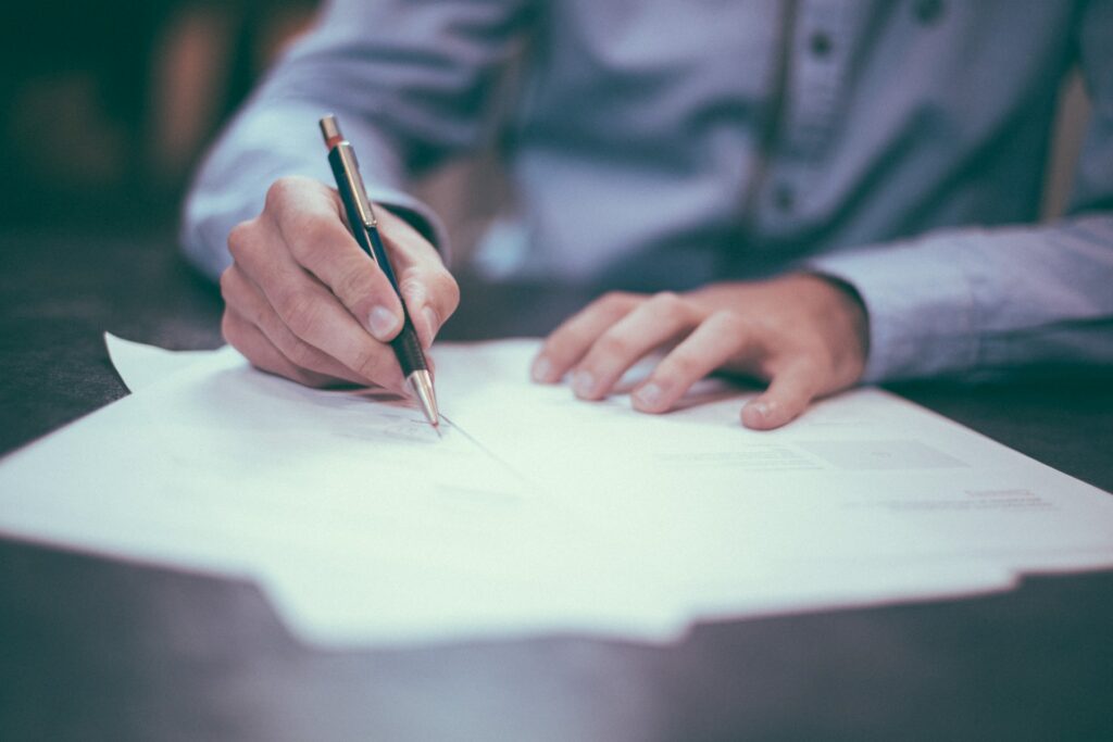 a person signing legal paperwork