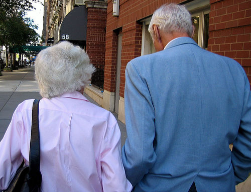 elder couple walking together